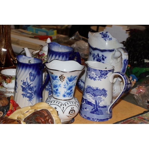 1001 - A COLLECTION OF VINTAGE BLUE AND WHITE JUGS PLUS A VASE - 5 IN TOTAL