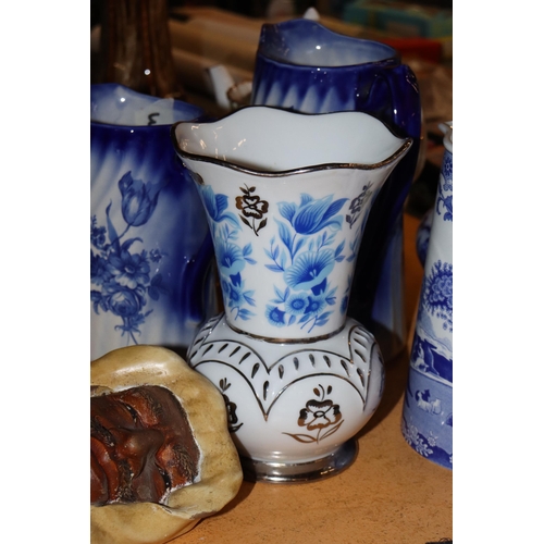 1001 - A COLLECTION OF VINTAGE BLUE AND WHITE JUGS PLUS A VASE - 5 IN TOTAL