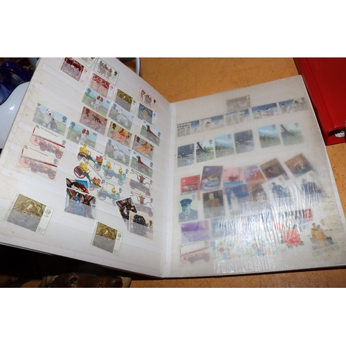 1003 - THREE VINTAGE STAMP ALBUMS CONTAINING WORLD STAMPS