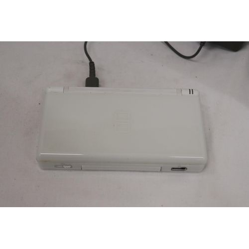 420 - A WHITE NINTENDO DS LITE WITH CHARGER, WORKING AT TIME OF CATALOGUING, NO WARRANTY GIVEN PLUS BRAIN ... 