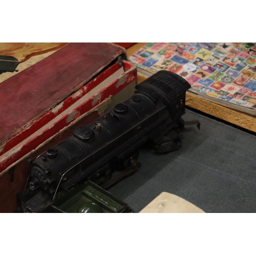 445 - A HORNBY, 'O' GAUGE, TRAIN SET PLUS A OO TRIX TRAIN SET, COMPRISING TWO LOCOS, CARRIAGES, TRACK AND ... 