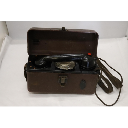 935 - A WORLD WAR 11 MILITARY TELEPHONE IN A LEATHER CASE