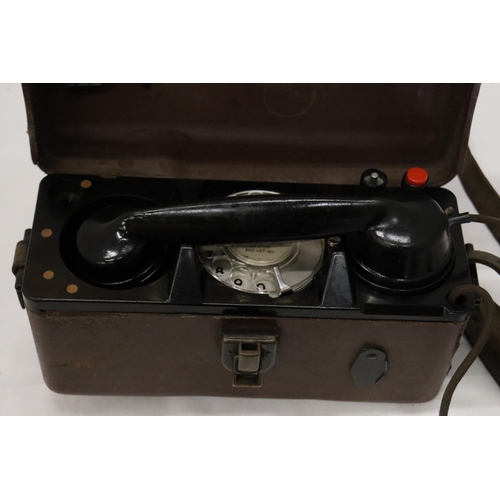 935 - A WORLD WAR 11 MILITARY TELEPHONE IN A LEATHER CASE