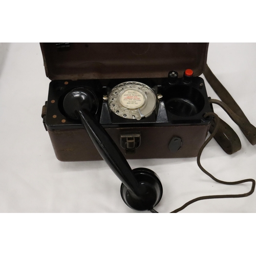 935 - A WORLD WAR 11 MILITARY TELEPHONE IN A LEATHER CASE