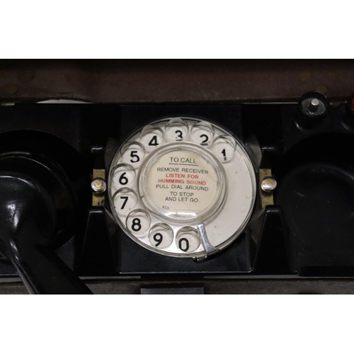 935 - A WORLD WAR 11 MILITARY TELEPHONE IN A LEATHER CASE