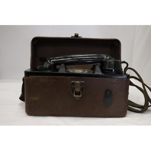 935 - A WORLD WAR 11 MILITARY TELEPHONE IN A LEATHER CASE