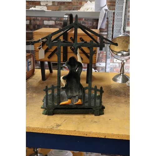 937 - A CAST HEAVY METAL 'DUCKY' UMBRELLA STICK STAND, HEIGHT APPROX 38CM