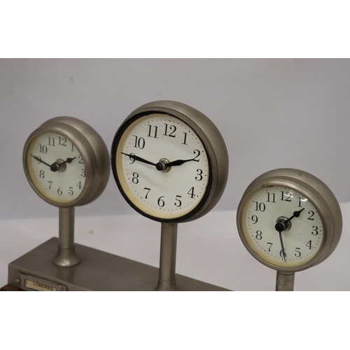 954 - A CLOCKS OF THE WORLD MANTLE CLOCK ON A WOODEN STAND, HEIGHT 24CM, LENGTH 36CM