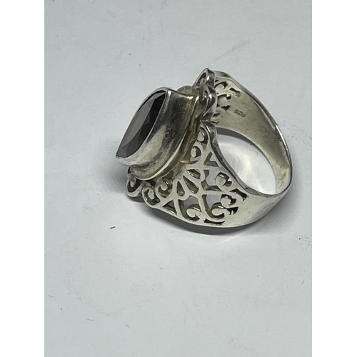 639 - A SILVER DRESS RING WITH A SMOKEY STONE SIZE P/Q IN A PRESENTATION BOX