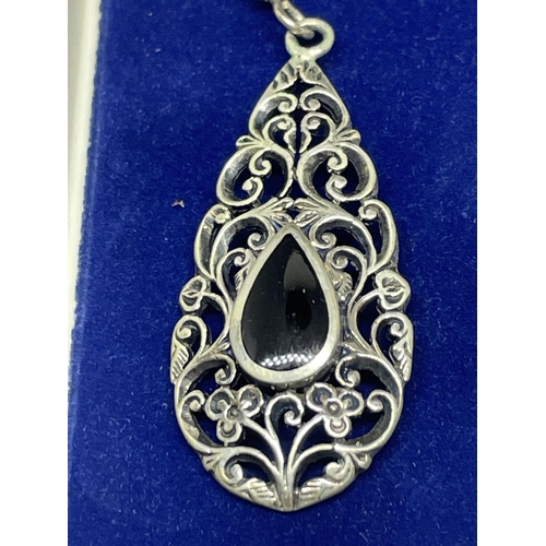 646 - A PAIR OF SILVER AND BLACK STONE DROP EARRINGS IN A PRESENTATION BOX