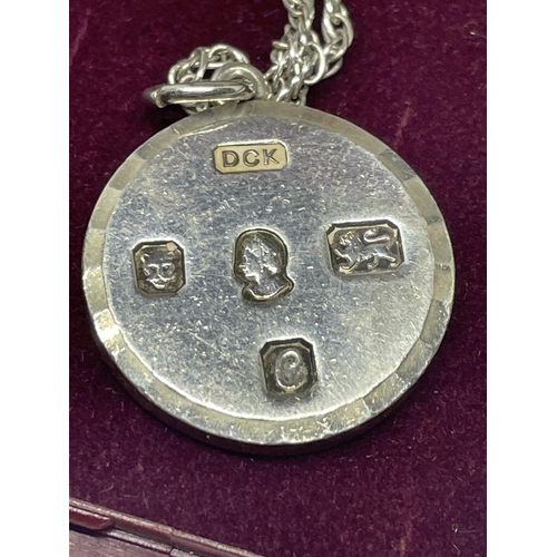 652 - A HALLMARKED LONDON SILVER CIRCULAR INGOT ON A CHAIN IN A PRESENTATION BOX