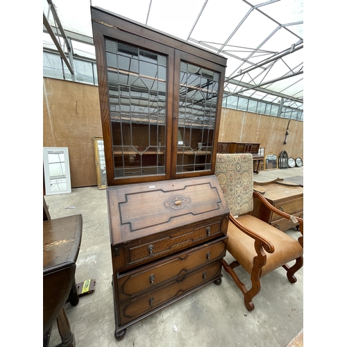 2959 - AN EARLY 20TH CENTURY OAK BUREAU BOOKCASE WITH GLAZED AND LEADED UPPER PORTION 36