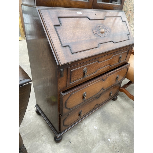 2959 - AN EARLY 20TH CENTURY OAK BUREAU BOOKCASE WITH GLAZED AND LEADED UPPER PORTION 36