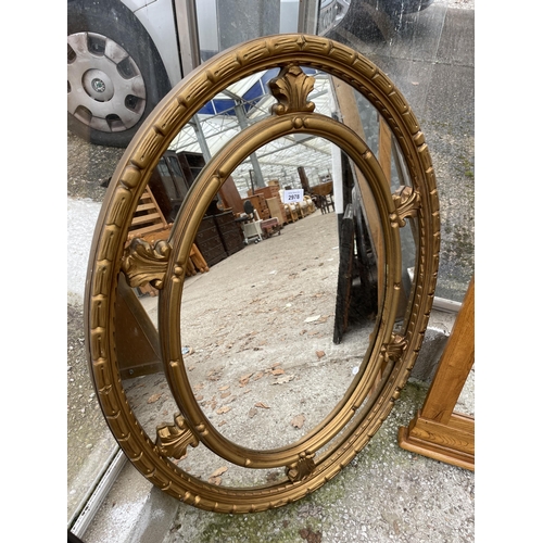 2978 - AN OVAL 19TH CENTURY STYLE GILT EFFECT WALL MIRROR, 37