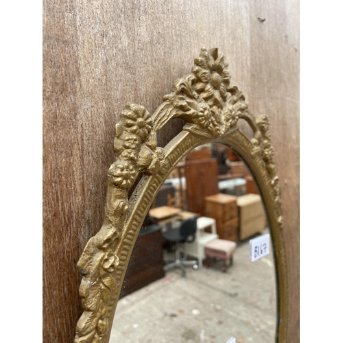 2986 - AN OVAL GILT METAL WALL MIRROR, 19