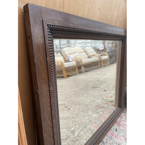 2999 - AN EDWARDIAN OAK FRAMED WALL MIRROR, 31