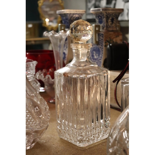 1036 - FOUR CUT GLASS DECANTERS ONE WITH A WHISKEY DECANTER LABEL