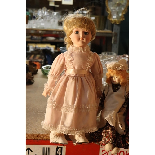 1040 - FOUR COLLECTABLE PORCELAIN DOLLS