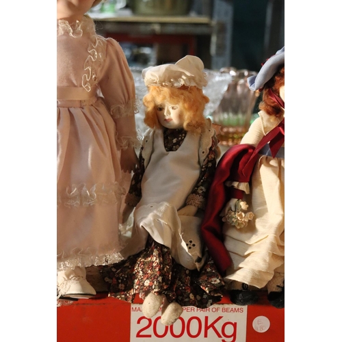 1040 - FOUR COLLECTABLE PORCELAIN DOLLS