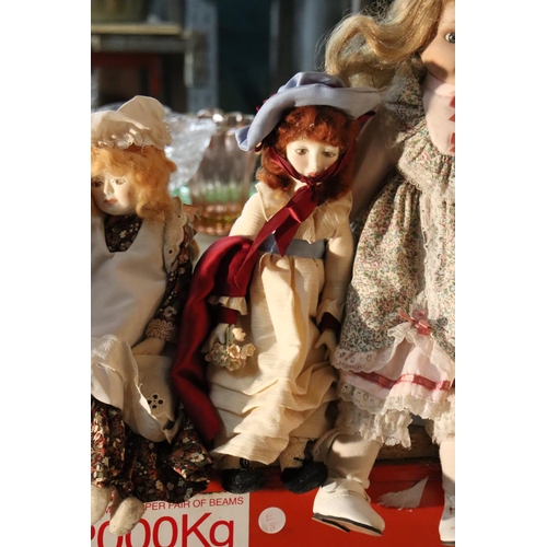 1040 - FOUR COLLECTABLE PORCELAIN DOLLS