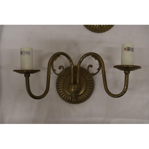 1041 - A PAIR OF BFRASS AND SCONCE CANDLE HOLDERS WALL LIGHTS