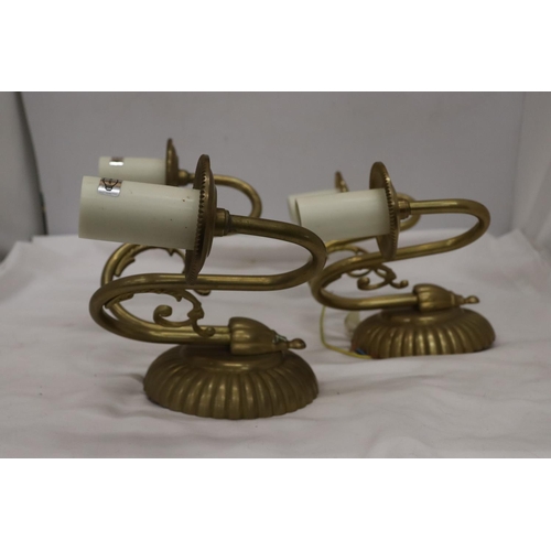 1041 - A PAIR OF BFRASS AND SCONCE CANDLE HOLDERS WALL LIGHTS