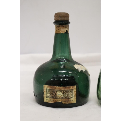 1044 - A THORENS MOVEMENT BLADON RACES MUSICAL BOTTLE MADE IN SWITZERLAND TOGETHER WITH A GREEN GLASS BOTTL... 