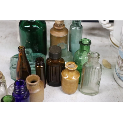 1089 - A LARGE QUANTITY OF VARIOUS COLOURED VINTAGE GLASS BOTTLES