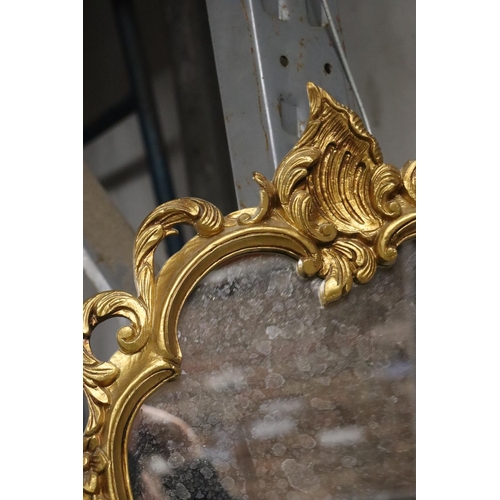 1119 - A GILT FRAMED SHIELD SHAPED MIRROR, HEIGHT 46CM