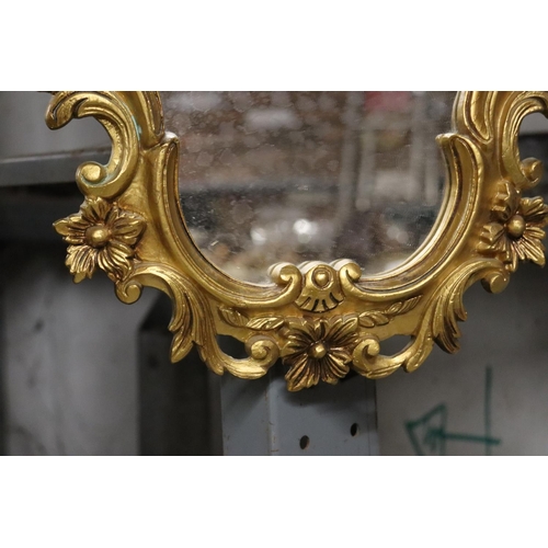 1119 - A GILT FRAMED SHIELD SHAPED MIRROR, HEIGHT 46CM