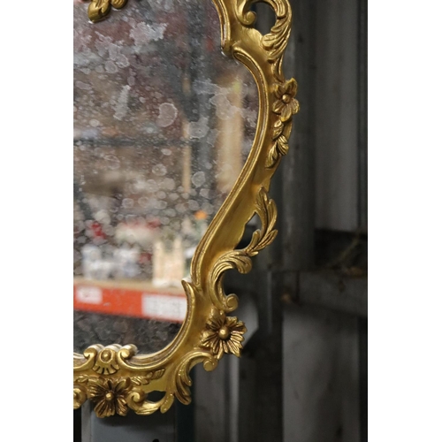 1119 - A GILT FRAMED SHIELD SHAPED MIRROR, HEIGHT 46CM