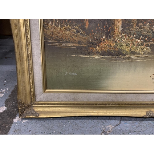 1256 - A GILT FRAMED OIL ON CANVAS OF A WOOD AND RIVER SCENE, 62CM X 52CM