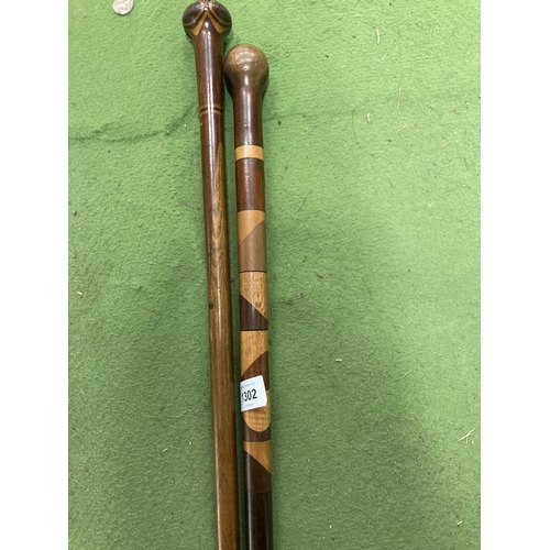 1302 - TWO VINTAGE WALKING STICKS ONE WITH TURNING SECTIONS