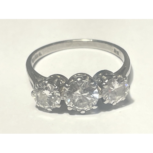 500 - AN 18 CARAT WHITE GOLD TRILOGY RING WITH DIAMONDS TO INCLUDE APPROXIMATELY A CENTRE 0.75 CARAT WITH ... 