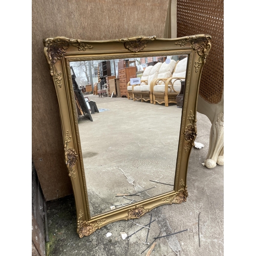 3009 - A GILT FRAMED WALL MIRROR, 30