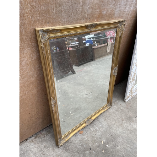 3014 - A MODERN GILT FRAMED BEVEL EDGE WALL MIRROR, 53