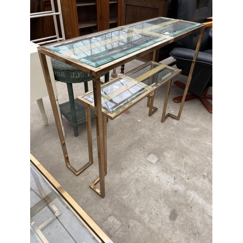 2680 - A GOLD COLOURED METALWARE TWO TIER CONSOLE TABLE WITH GLASS SHELVES AND MATCHING COFFEE TABLE