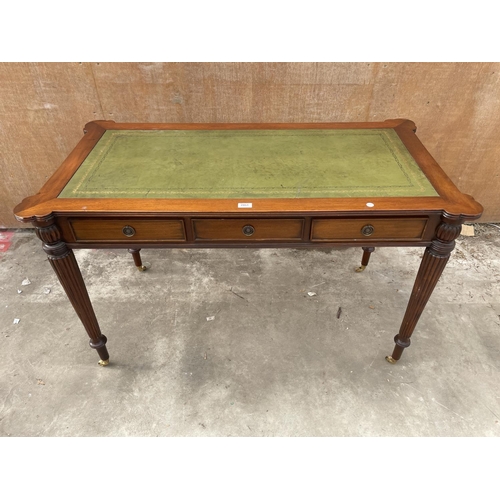 2951 - A REGENCY STYLE MAHOGANY TABLE ENCLOSING THREE DRAWERS AND THREE SHAM DRAWERS WITH INSET LEATHER TOP... 