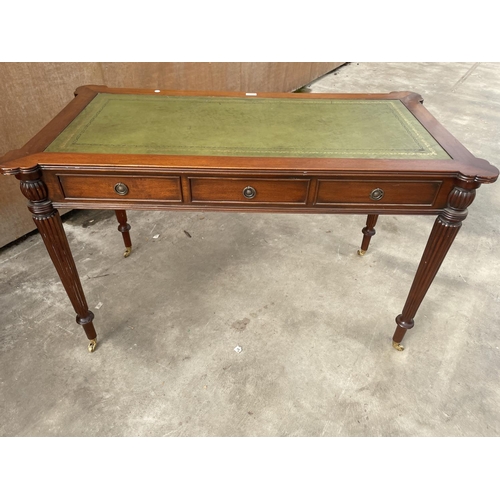 2951 - A REGENCY STYLE MAHOGANY TABLE ENCLOSING THREE DRAWERS AND THREE SHAM DRAWERS WITH INSET LEATHER TOP... 