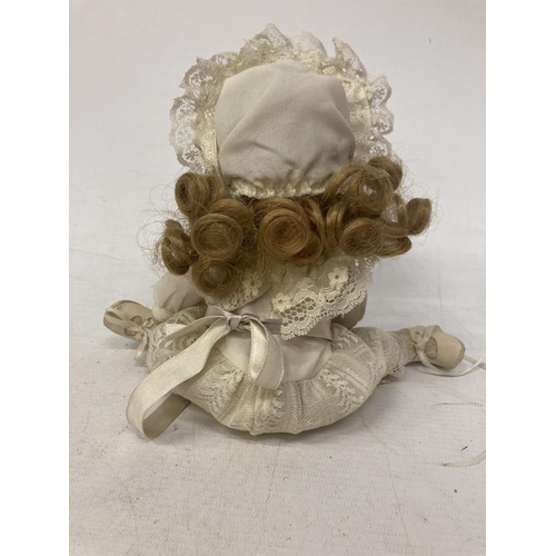 461 - A VINTAGE SHOW STOPPER PORCELAIN DOLL WITH A LACE DRESS AND PAINTED BOOTS