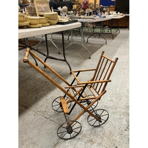 477 - A VINTAGE FOLDING DOLLS PUSH CHAIR