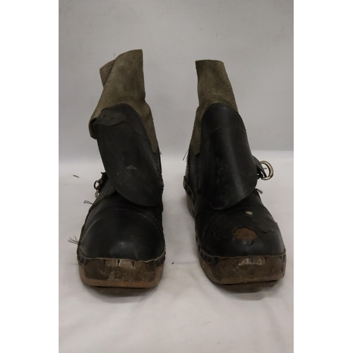 34 - A PAIR OF VINTAGE LEATHER AND WOODEN CLOGS