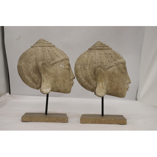 135 - TWO BUDDAH HEADS ON STANDS, HEIGHT 27CM