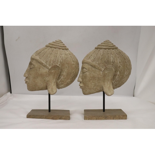 135 - TWO BUDDAH HEADS ON STANDS, HEIGHT 27CM