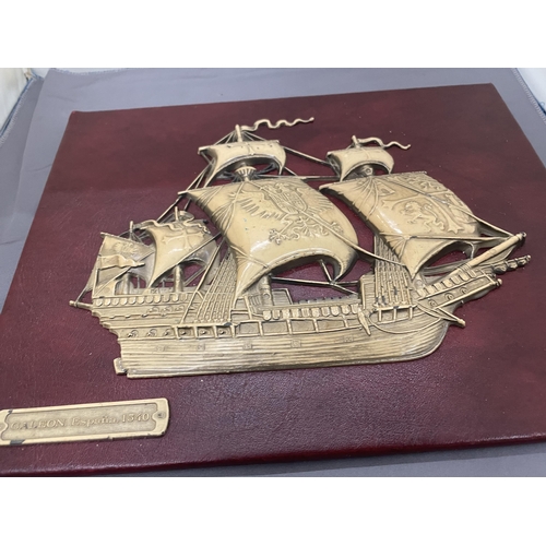 210 - A VINTAGE EMBOSSED SPANISH GALLEON ON RED MOROCCO LEATHER, 30CM X 24CM