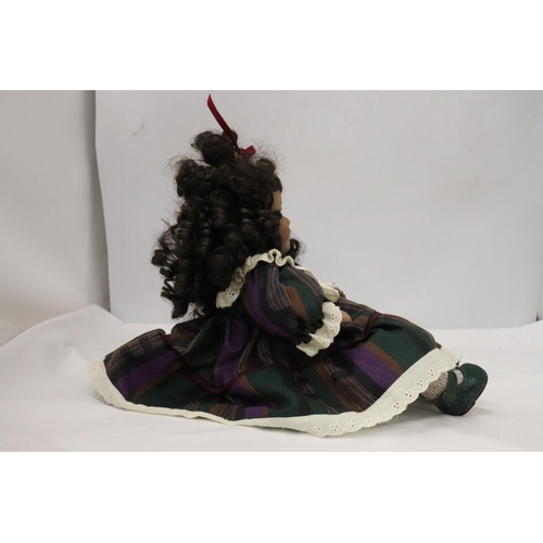 442 - A VINTAGE CHINA DOLL IN SEATED POSE