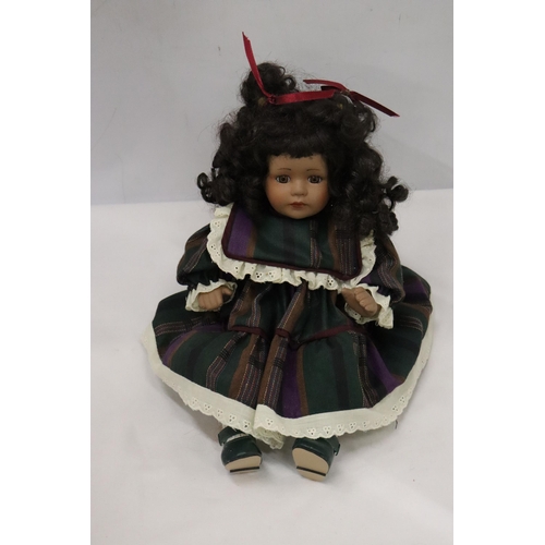 442 - A VINTAGE CHINA DOLL IN SEATED POSE