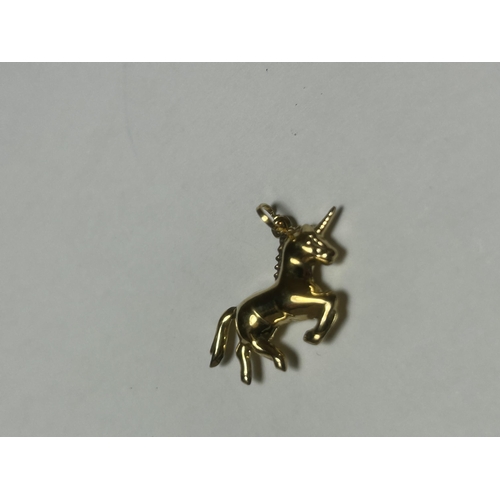 516 - A 9CT YELLOW GOLD UNICORN CHARM