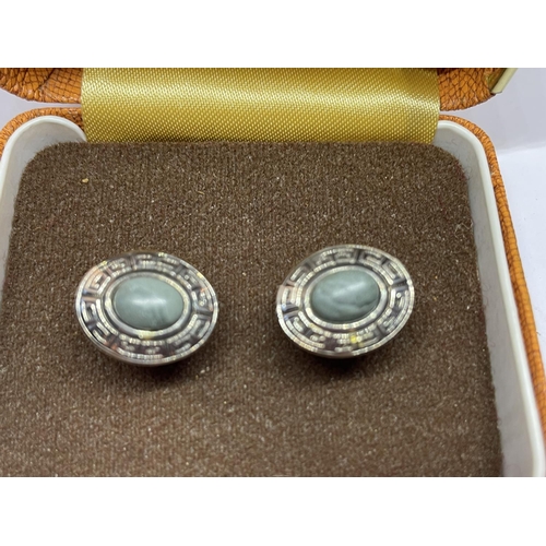 556 - TWO PAIRS OF SILVER CUFFLINKS IN A PRESENTATION BOX