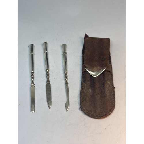 100 - A MARKED STERLING SILVER THREE PIECE MANICURE SET IN A LEATHER AND SILVER CASE